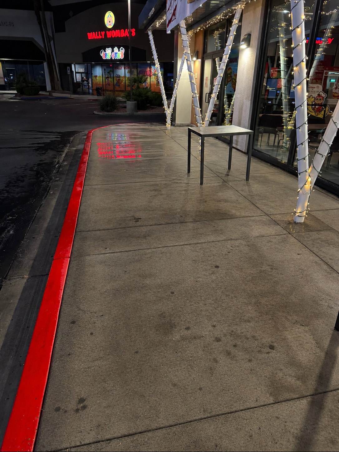 Grimy commercial sidewalk before pressure washing