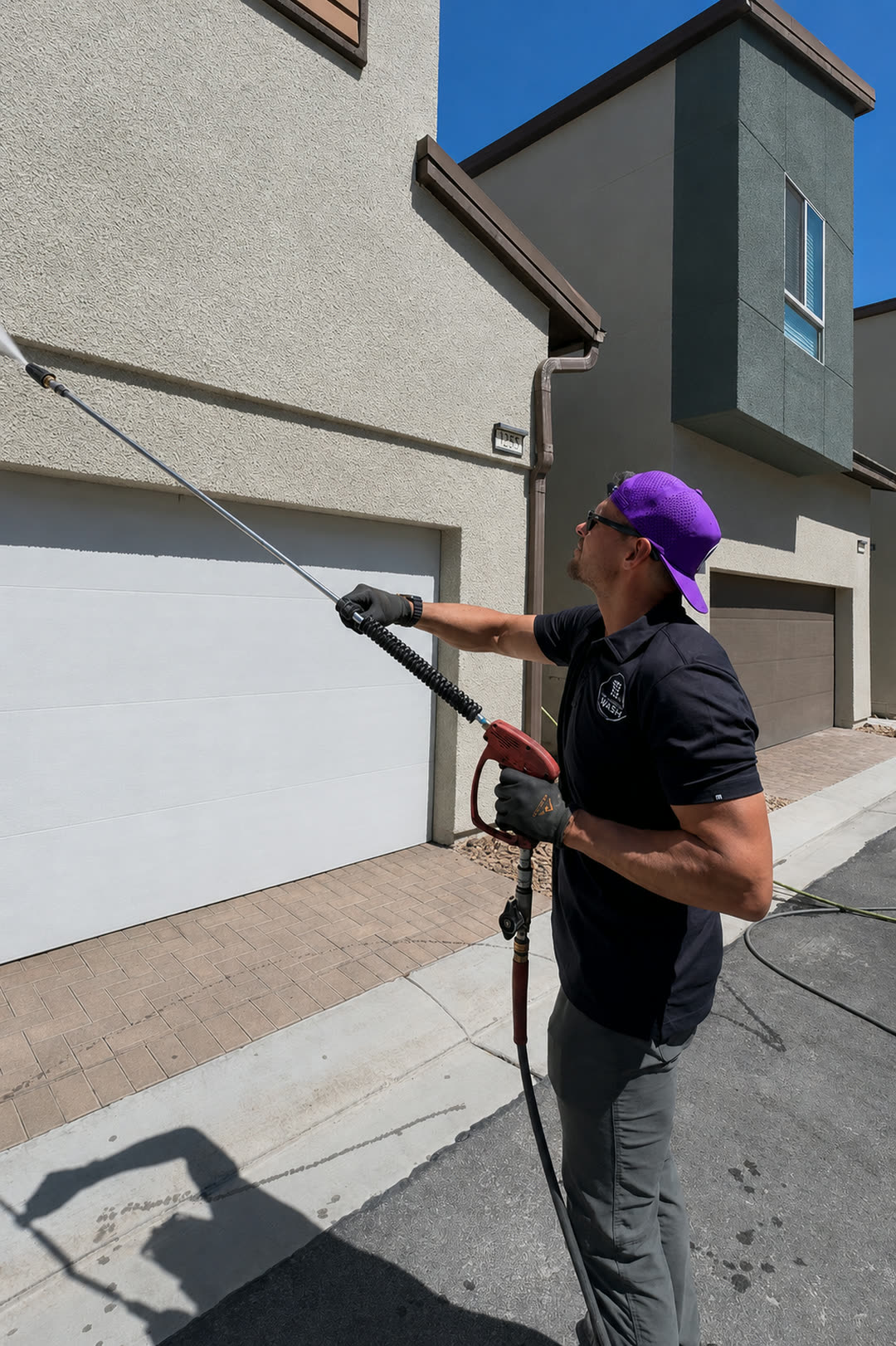 LVC Pressure Wash owner washing the exterior of a Las Vegas home